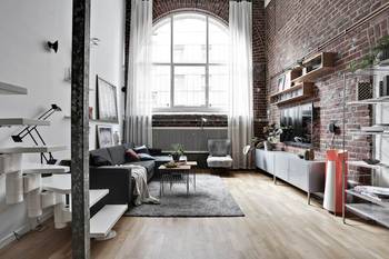 Urban Loft: The Harmony of Brick and Light in an Industrial Interior