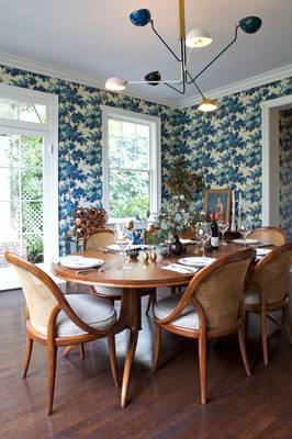 Beautiful design of dining room in house in fusion style.