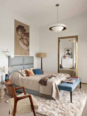 Elegant Minimalist Bedroom with Classical Accents and Harmonious Color Palette