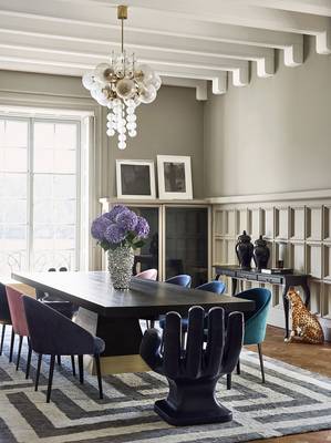 Photo of dining room in country house in fusion style.