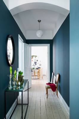 Dramatic Teal-Blue Vestibule with Elegant Classical Details