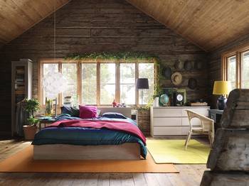 Photo of bedroom in country house in Chalet style.