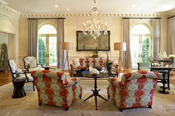 Classical Elegance with Modern Accents: Spacious Living Room with French Doors and Vibrant Furniture