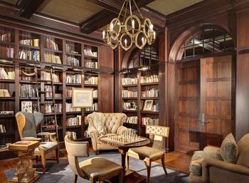 Beautiful design of library in house in colonial style.