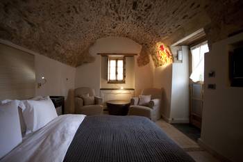 Bedroom in cottage in Mediterranean style.