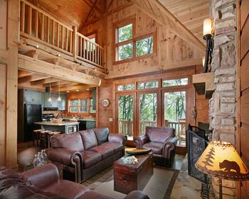 Cozy mountain chalet with double-height space: harmony of wood, stone, and nature