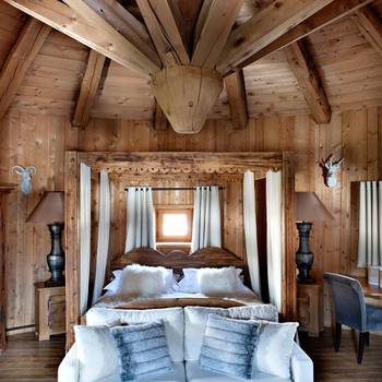 Bedroom interior in house in Chalet style.