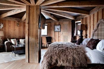 Beautiful example of bedroom in private house in Chalet style.