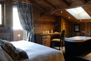 Beautiful example of bedroom in cottage in Chalet style.