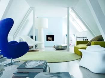 Beautiful design of attic in private house in artistic style.