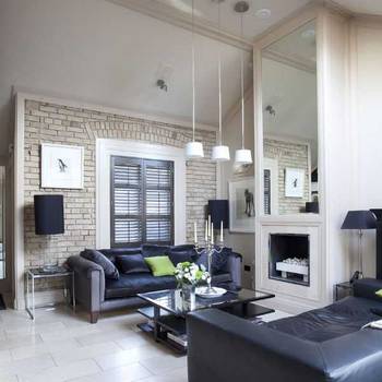 Elegant Living Room with Brick Accent Wall: Modern Classic in Neutral Tones