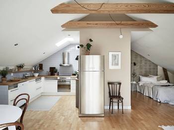 Interior design of attic in cottage in scandinavian style.