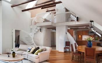 Beautiful design of attic in country house in artistic style.
