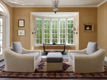 Serene Elegance: Interior with Bay Window and Symmetrical Composition