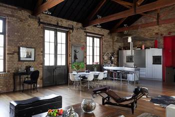 Industrial Loft with Character: Brick, Wood, and Modern Design