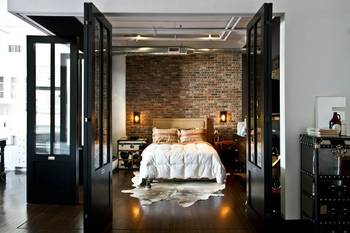 Interior design of bedroom in house in loft style.