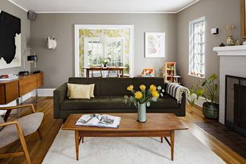 Cozy modern living room with mid-century elements in a neutral palette