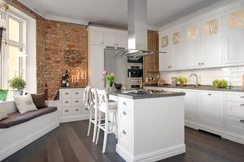 Photo of kitchen in country house in loft style.