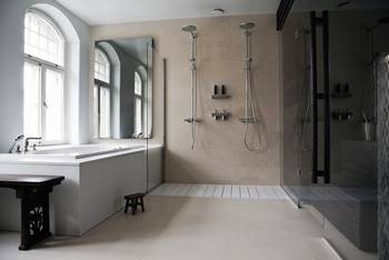 Design of bathroom in country house in loft style.