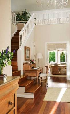 Classic Elegance: Light Walls and Warm Wood in Country House Interior
