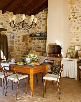 Dining room example in cottage in Mediterranean style.