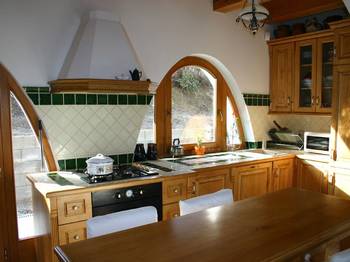 Interior design of kitchen in country house in colonial style.