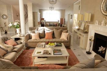 Classical Elegance: Light Interior with Peach Accents and Marble Details