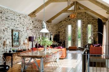 Interior of dining room in cottage in loft style.