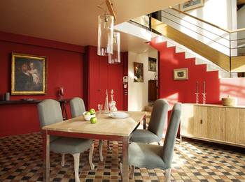 Design of dining room in country house in artistic style.