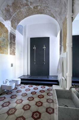 Interior design of bathroom in private house in loft style.