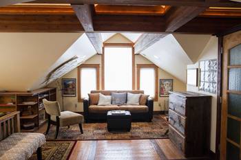 Photo of attic in country house in artistic style.