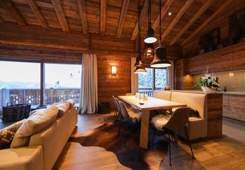 Beautiful design of dining room in country house in Chalet style.