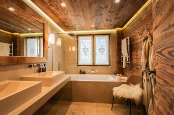 Beautiful design of bathroom in cottage in Chalet style.