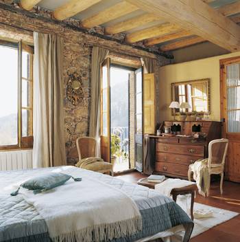 Interior of bedroom in cottage in Chalet style.