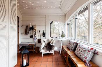 Interior design of veranda in country house in scandinavian style.