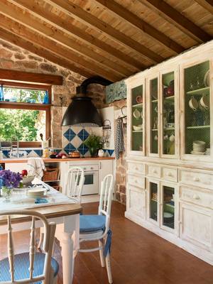 Interior of kitchen in cottage in Mediterranean style.