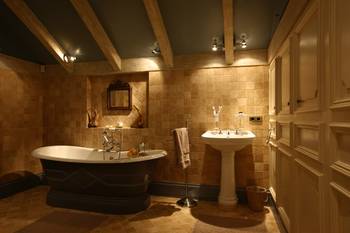 Beautiful design of bathroom in country house in artistic style.
