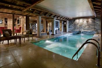 Beautiful design of pool in house in loft style.