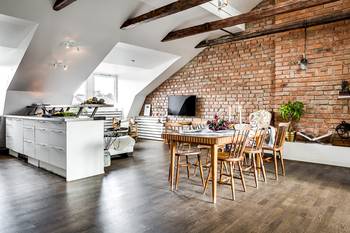 Photo of dining room in private house in loft style.