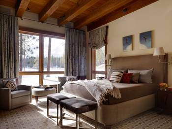 Interior of bedroom in cottage in Chalet style.