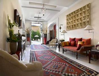Beautiful design of hallway in cottage in ethnic style.