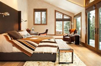 Bedroom interior in private house in Chalet style.