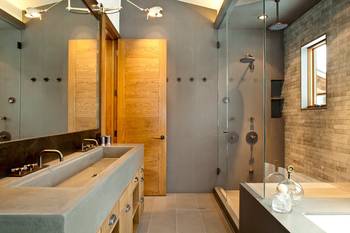 Beautiful design of bathroom in country house in loft style.