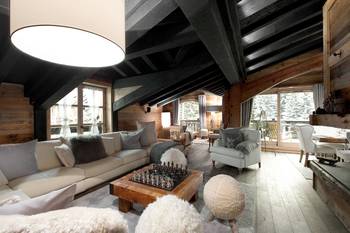 Beautiful design of attic in house in Chalet style.
