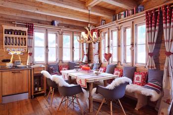 Photo of interior with orange details in cottage.